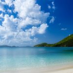 Caribbean beach with view of hills