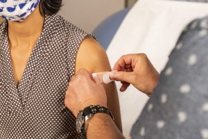 A woman being vaccinated