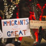 Sign at protest: Immigrants make America great