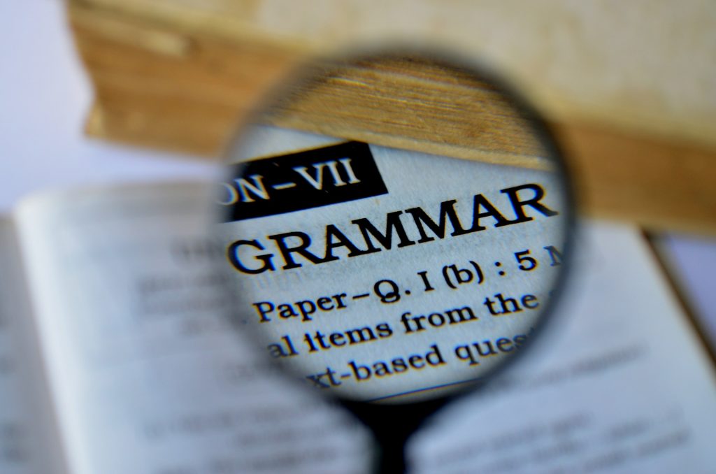 Magnifying glass over the word grammar