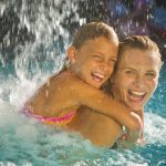 Mother and child playing in water